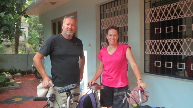 a man and a woman standing next to their bikes at Countryside inn in Tiruvankod