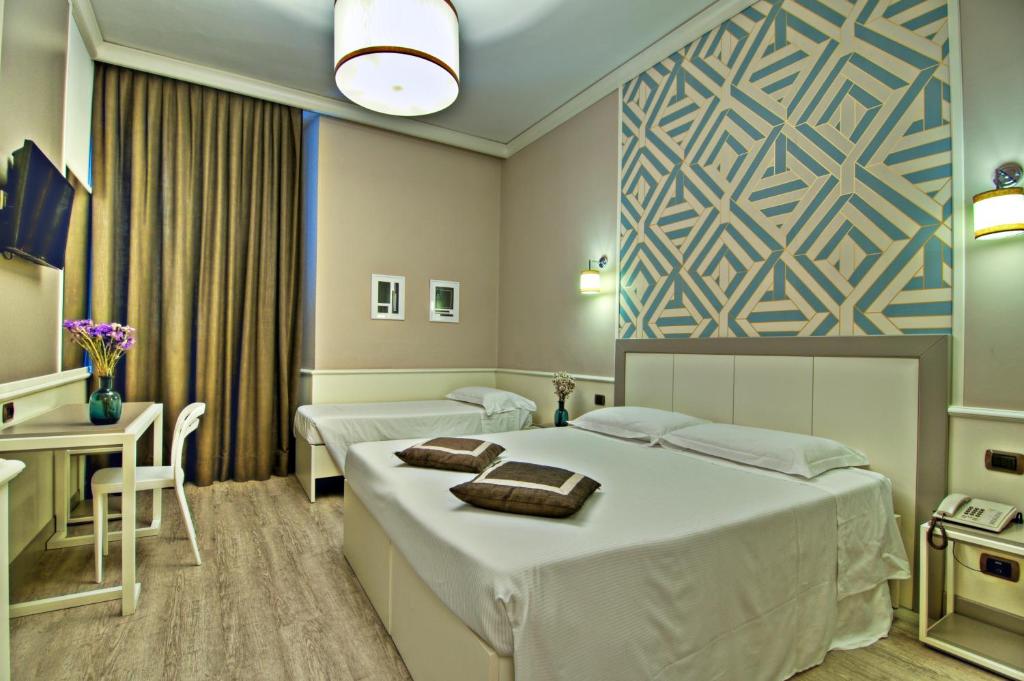 Łóżko lub łóżka w pokoju w obiekcie Hotel Golf