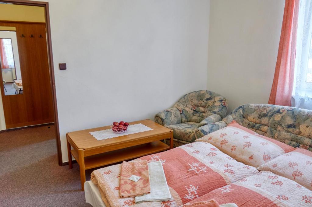 Ένα ή περισσότερα κρεβάτια σε δωμάτιο στο Hotel Alf