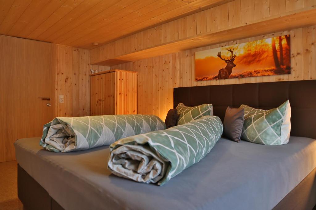 Postel nebo postele na pokoji v ubytování Apartments Hänsler