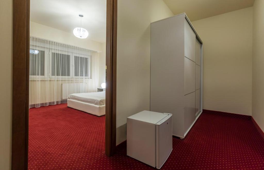 Postel nebo postele na pokoji v ubytování Orhideea Residence & Spa