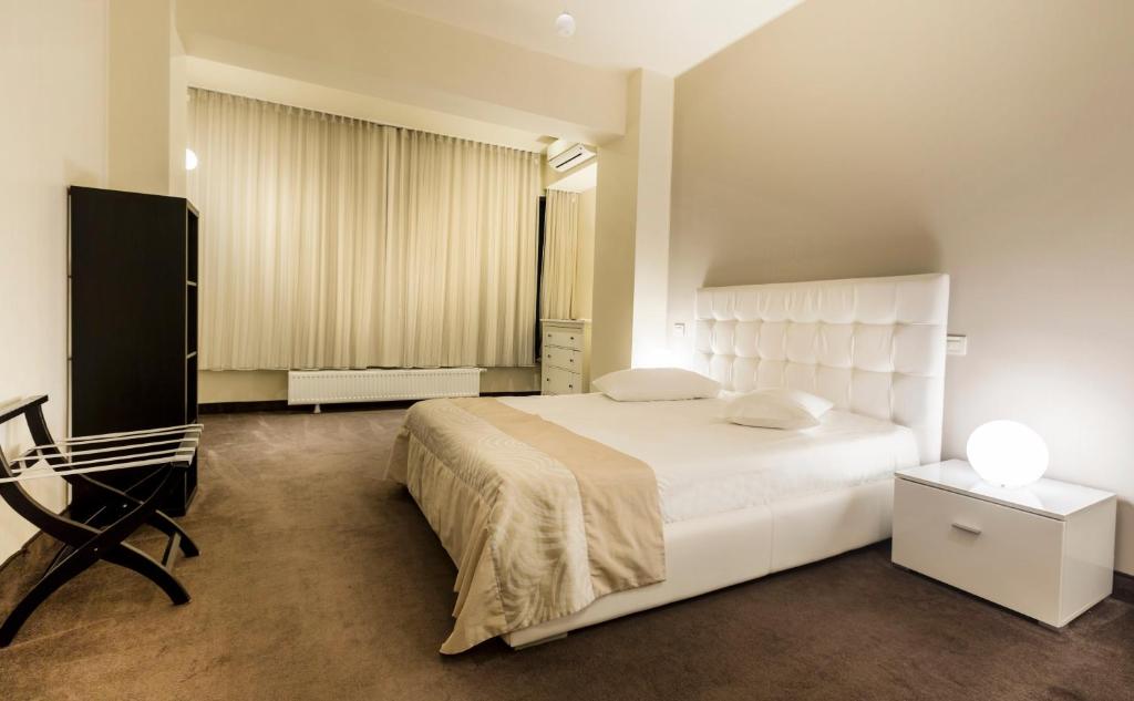 Postel nebo postele na pokoji v ubytování Orhideea Residence & Spa