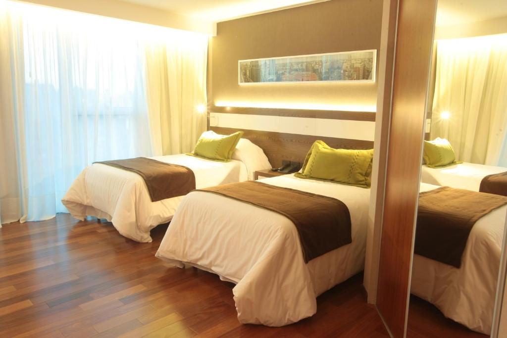 Postel nebo postele na pokoji v ubytování Yrigoyen 111 Hotel