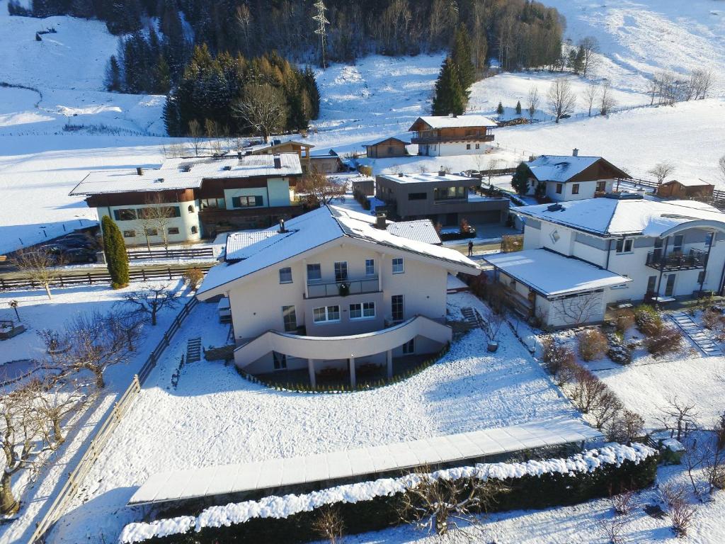 an aerial view of a house in the snow at Panorama Apartments Bruck in Bruck an der Großglocknerstraße