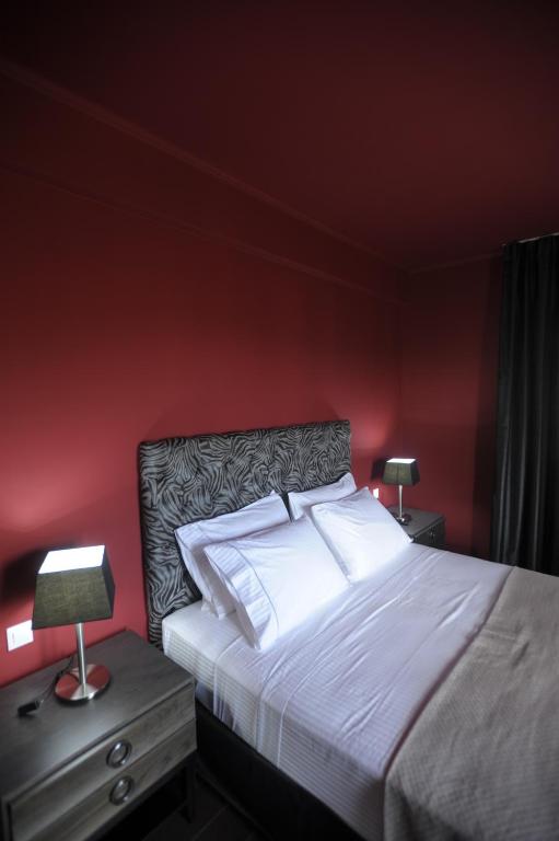 Postel nebo postele na pokoji v ubytování Theasis Hotel Paramythia