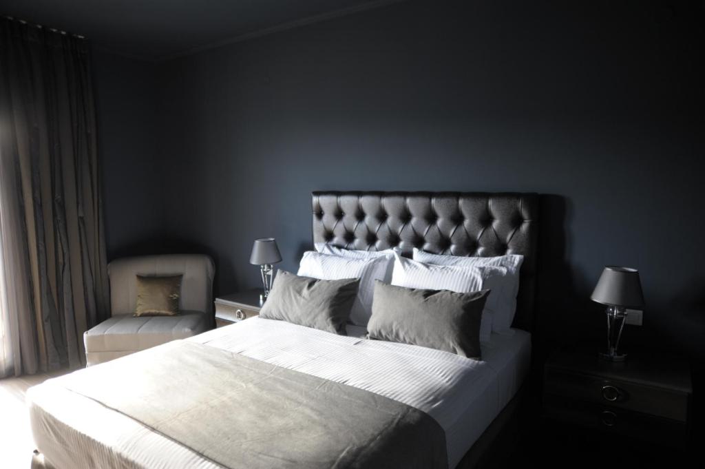Postel nebo postele na pokoji v ubytování Theasis Hotel Paramythia