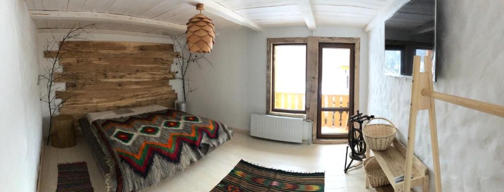 Postel nebo postele na pokoji v ubytování ГУЦУЛЬСЬКА ХАТА