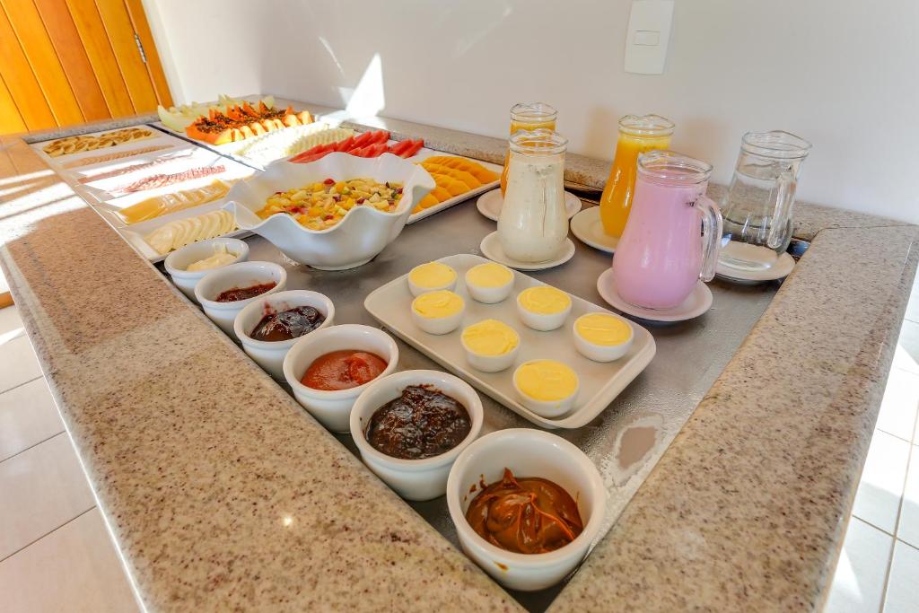 a counter with eggs and other ingredients on it at Pousada Ilha Faceira in Florianópolis