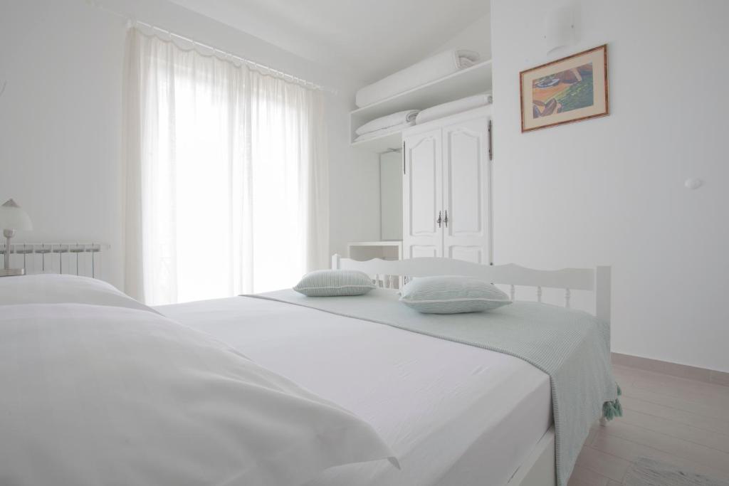 Postel nebo postele na pokoji v ubytování Apartments Aurelia