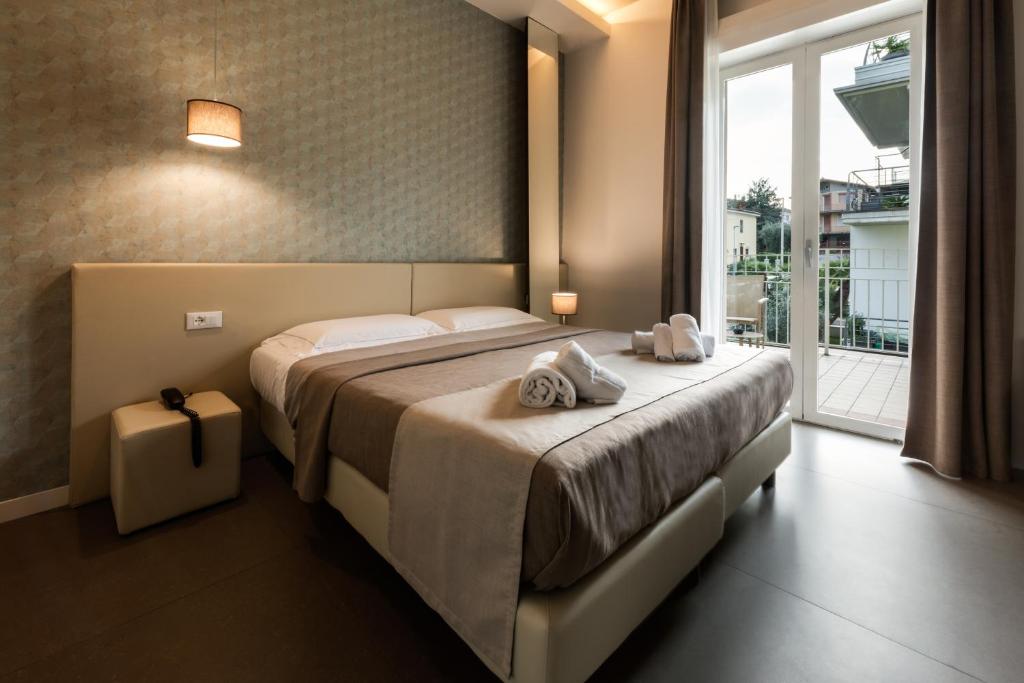 Posteľ alebo postele v izbe v ubytovaní Hotel Palazzo del Garda & Spa