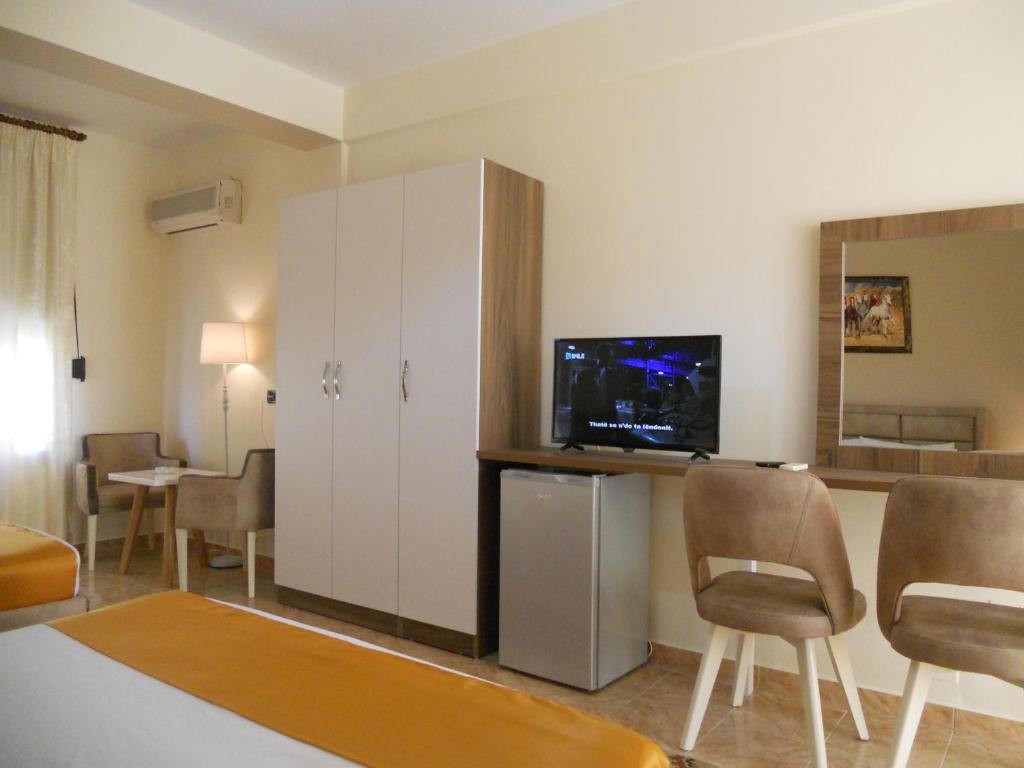 TV a/nebo společenská místnost v ubytování Onorato Hotel