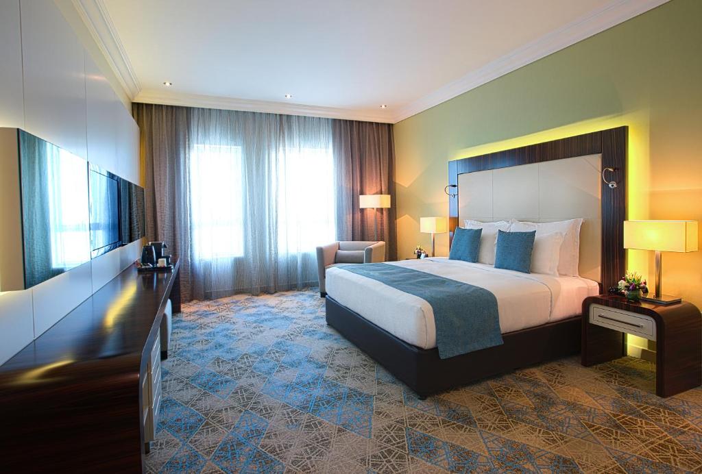 Postel nebo postele na pokoji v ubytování Elite Byblos Hotel
