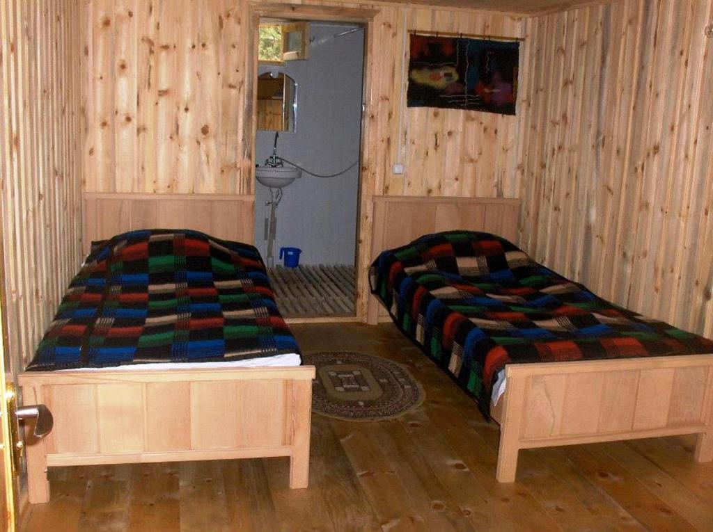 Postel nebo postele na pokoji v ubytování Guest House Mirgvela