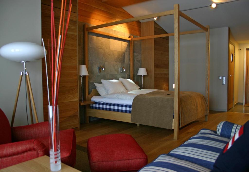 Postel nebo postele na pokoji v ubytování Hestraviken Hotell & Spa