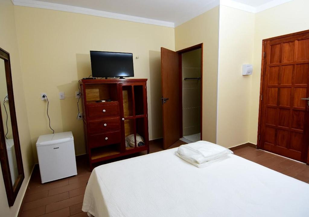 Postel nebo postele na pokoji v ubytování Recanto Alto da Serra