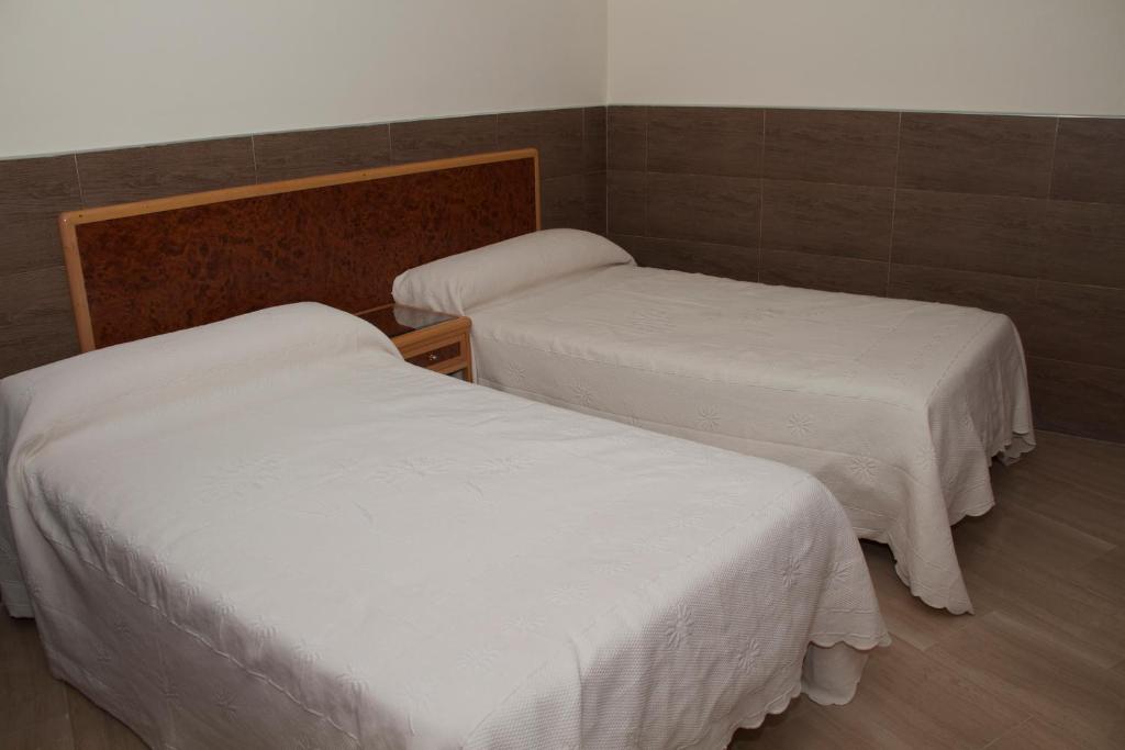 A bed or beds in a room at Domus Viatoris