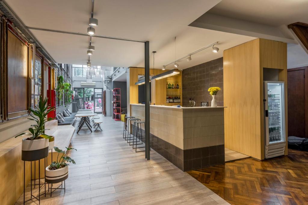 a lobby with a bar in a building at Puerto Limon Hostel in Buenos Aires