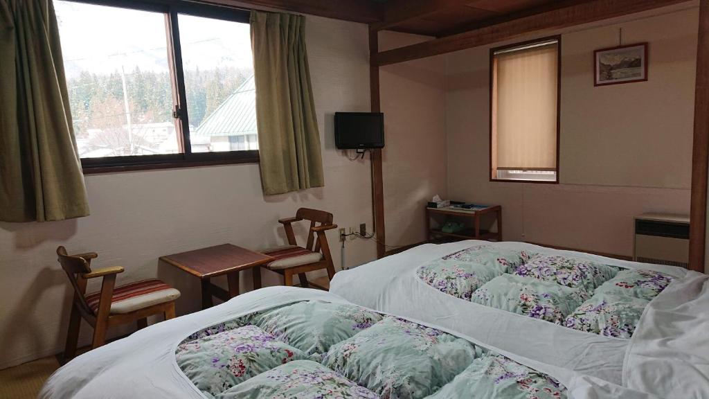 Postel nebo postele na pokoji v ubytování Hotel Weisser Hof Happei