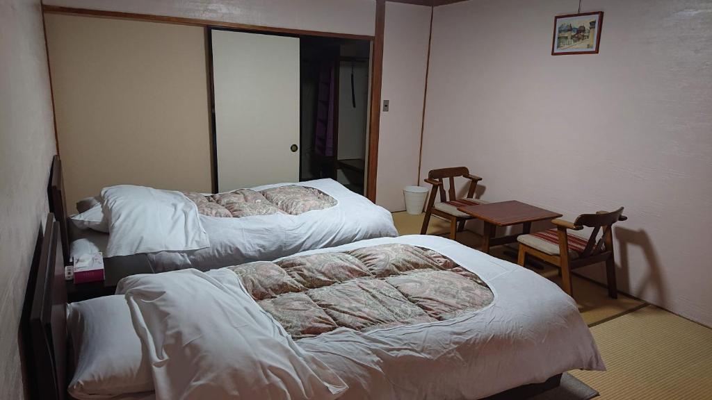 Postel nebo postele na pokoji v ubytování Hotel Weisser Hof Happei