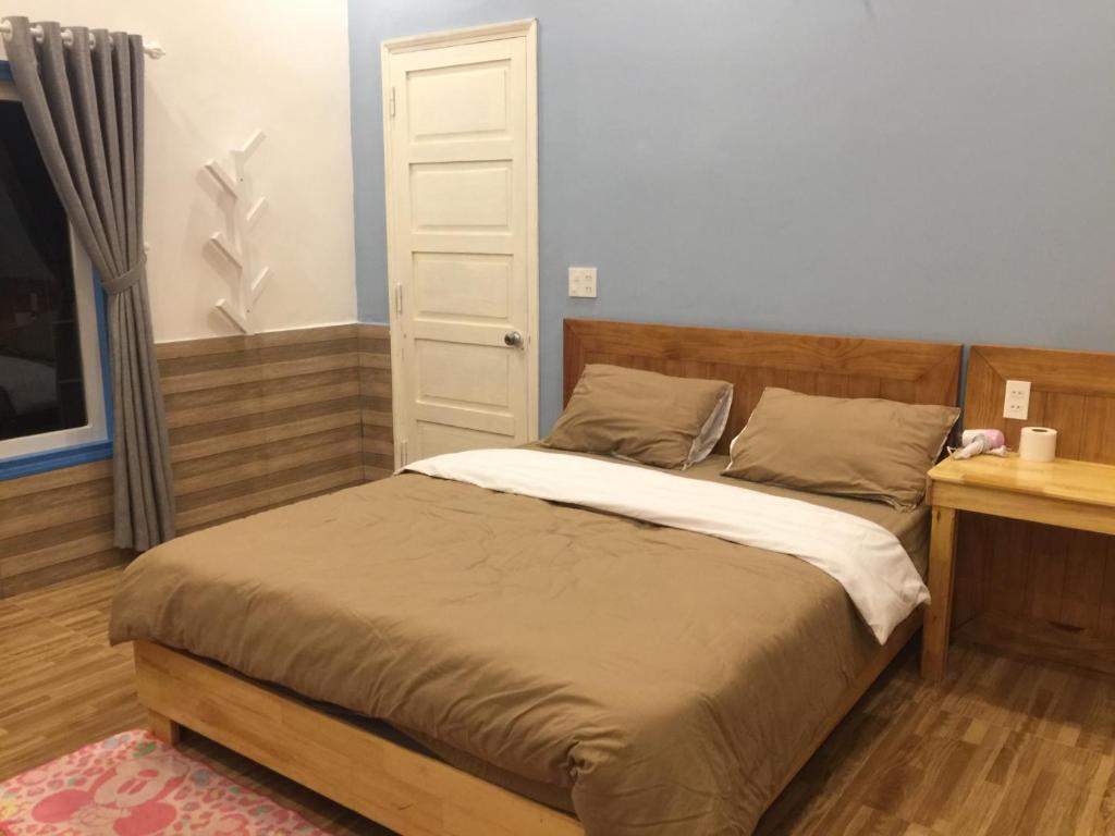 Postel nebo postele na pokoji v ubytování Ruby Dalat Hostel
