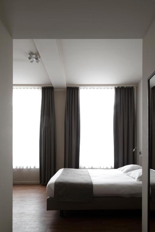 Postel nebo postele na pokoji v ubytování Hotel Karmel