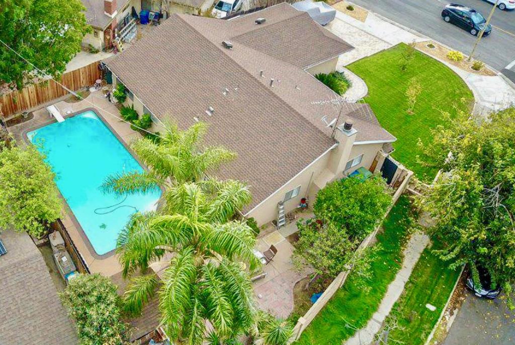 an overhead view of a house with a swimming pool at 11640 Gothic Avenue in Los Angeles