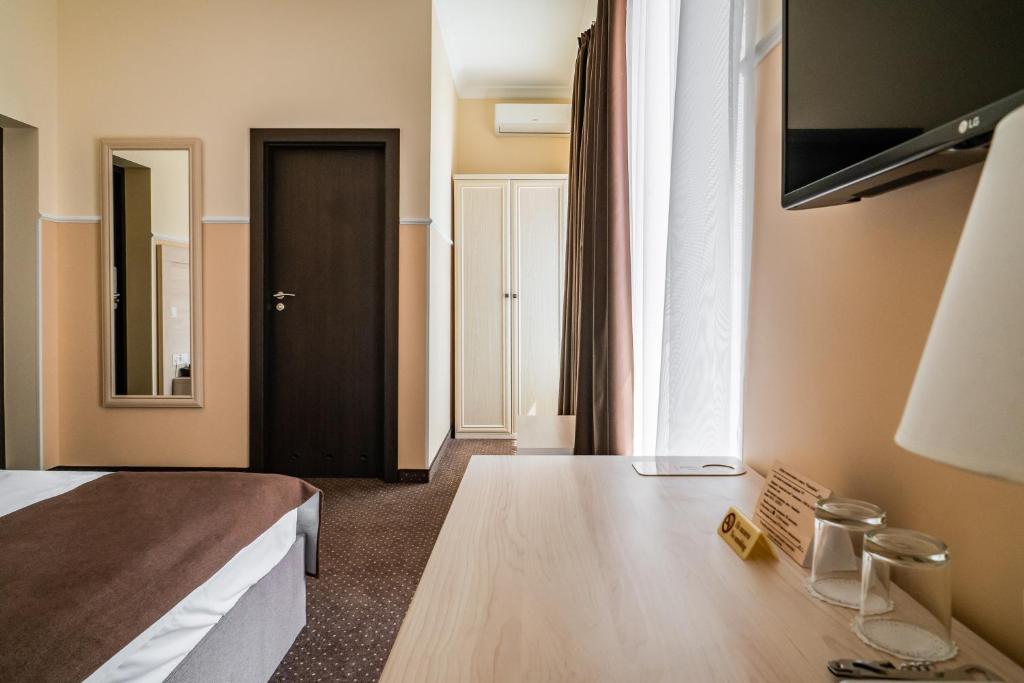TV a/nebo společenská místnost v ubytování Potemkinn Hotel