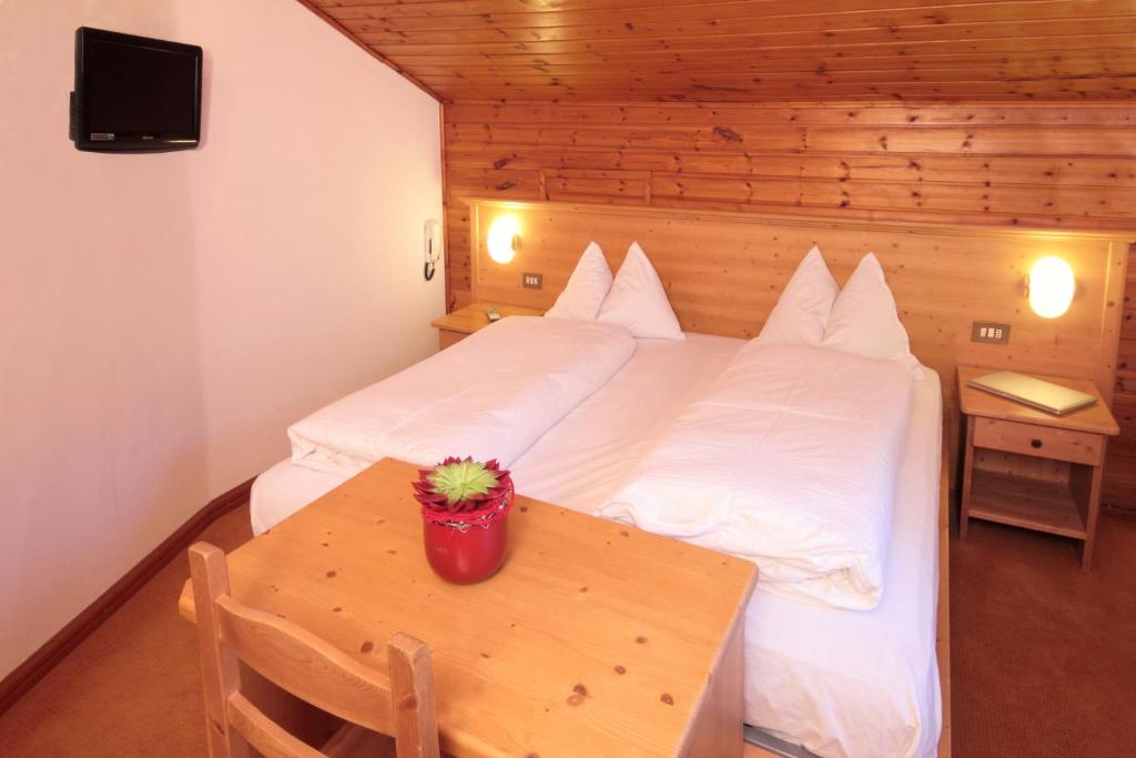 Postel nebo postele na pokoji v ubytování Pension & Residence Astoria