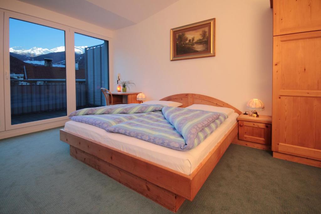 Postel nebo postele na pokoji v ubytování Pension & Residence Astoria