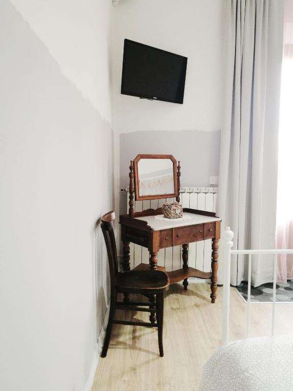 Televízia a/alebo spoločenská miestnosť v ubytovaní B&B Casa Dalma