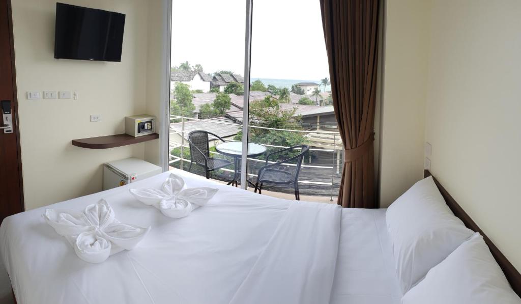 Postel nebo postele na pokoji v ubytování Top Hostel Samui