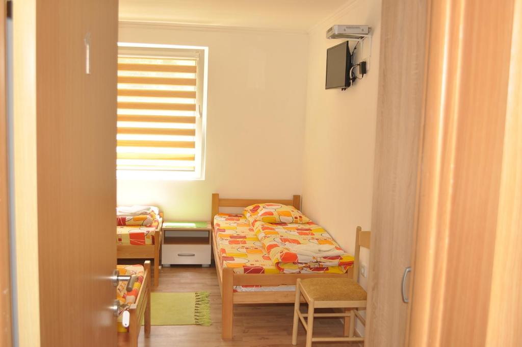Postel nebo postele na pokoji v ubytování Apartments & Rooms Bojic
