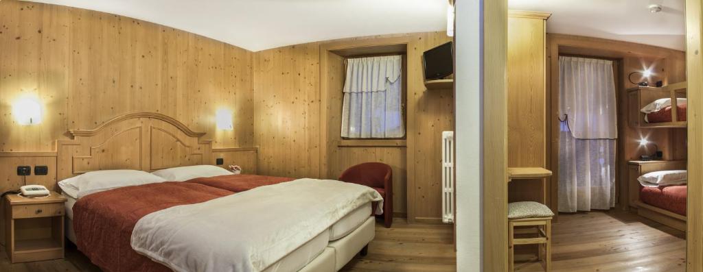 Postel nebo postele na pokoji v ubytování Hotel Pedranzini