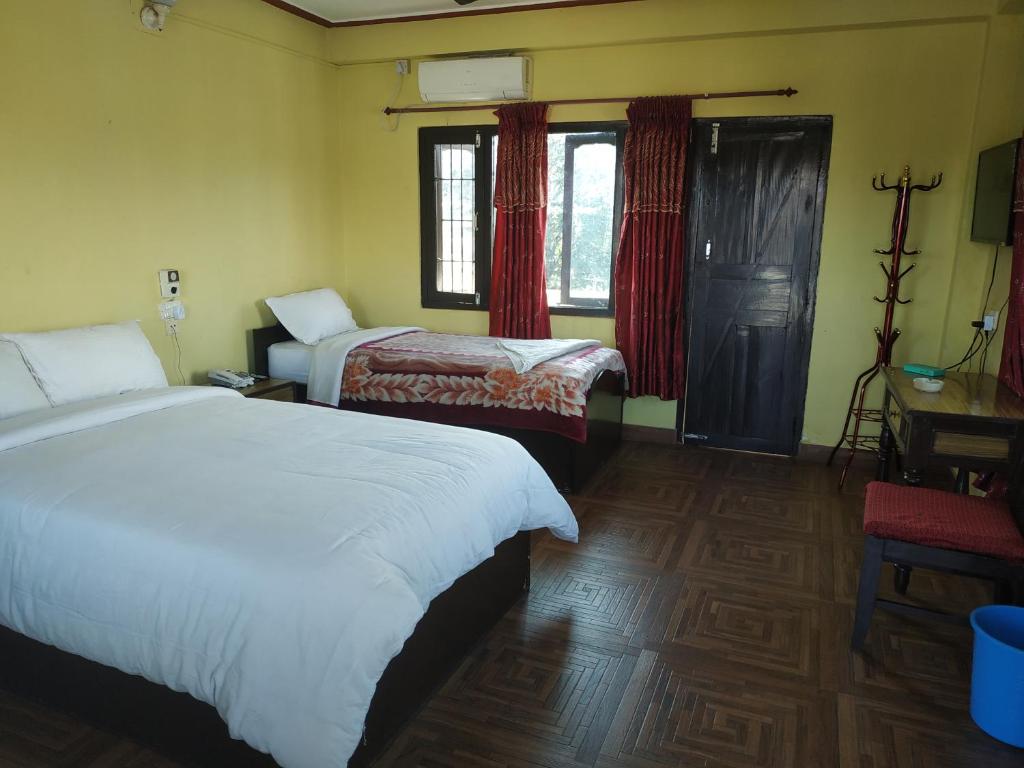 Letto o letti in una camera di Trekkers Lodge
