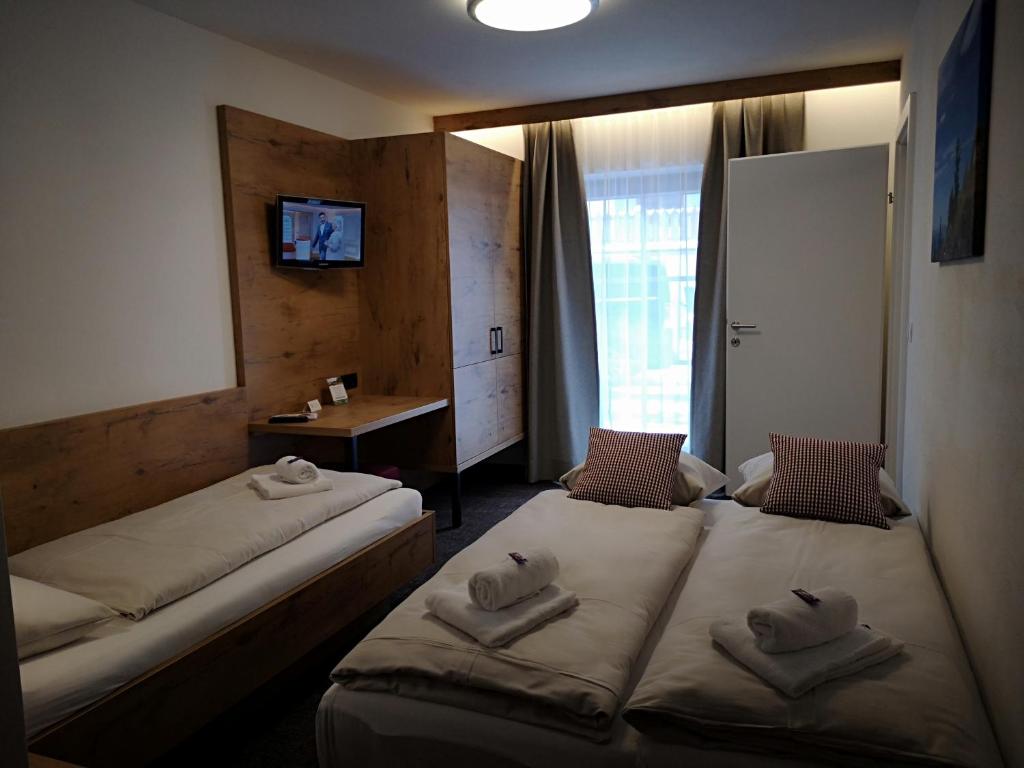 Posteľ alebo postele v izbe v ubytovaní Hotel Aschauer Hof z'Fritzn