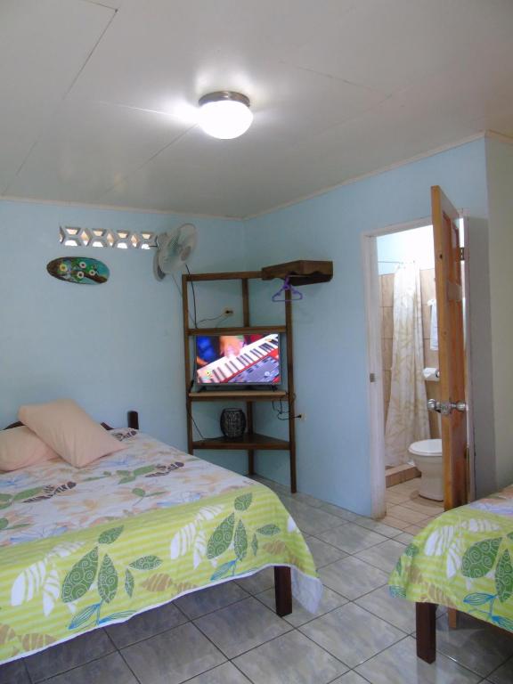 Postel nebo postele na pokoji v ubytování Posada Rural Río Celeste