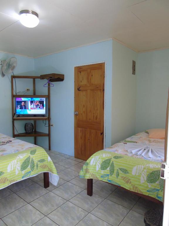 Postel nebo postele na pokoji v ubytování Posada Rural Río Celeste