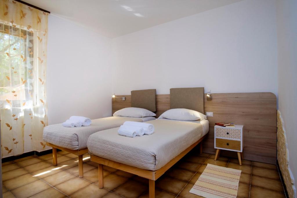Postel nebo postele na pokoji v ubytování Residence Appartamenti Caffarena