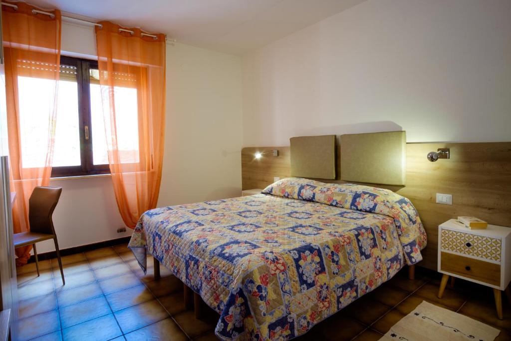 Postel nebo postele na pokoji v ubytování Residence Appartamenti Caffarena