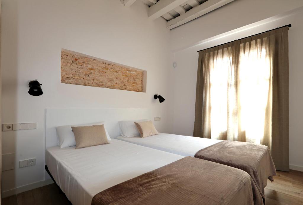 Postel nebo postele na pokoji v ubytování ClassBedroom Port Ramblas