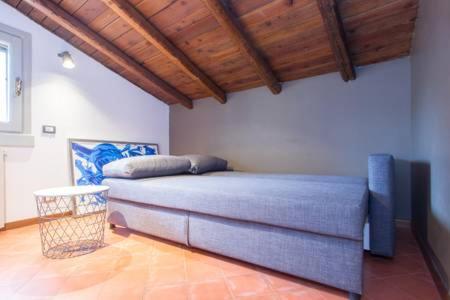 A bed or beds in a room at Papavero Accademia Carrara