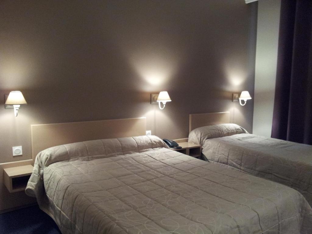Postel nebo postele na pokoji v ubytování Hotel Azur