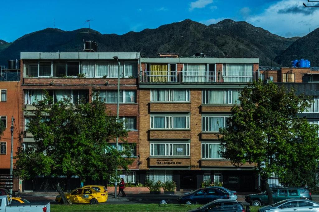 a large building with a building on top of it at Apartamentos Galerías in Bogotá