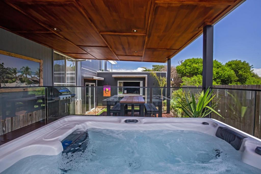 a jacuzzi tub in the backyard of a house at Island Getaway Cape Woolamai in Cape Woolamai