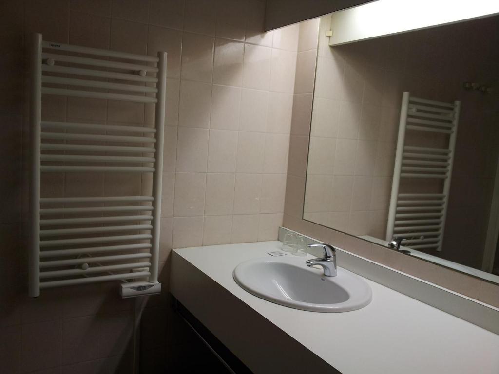 Koupelna v ubytování Hotel Azur
