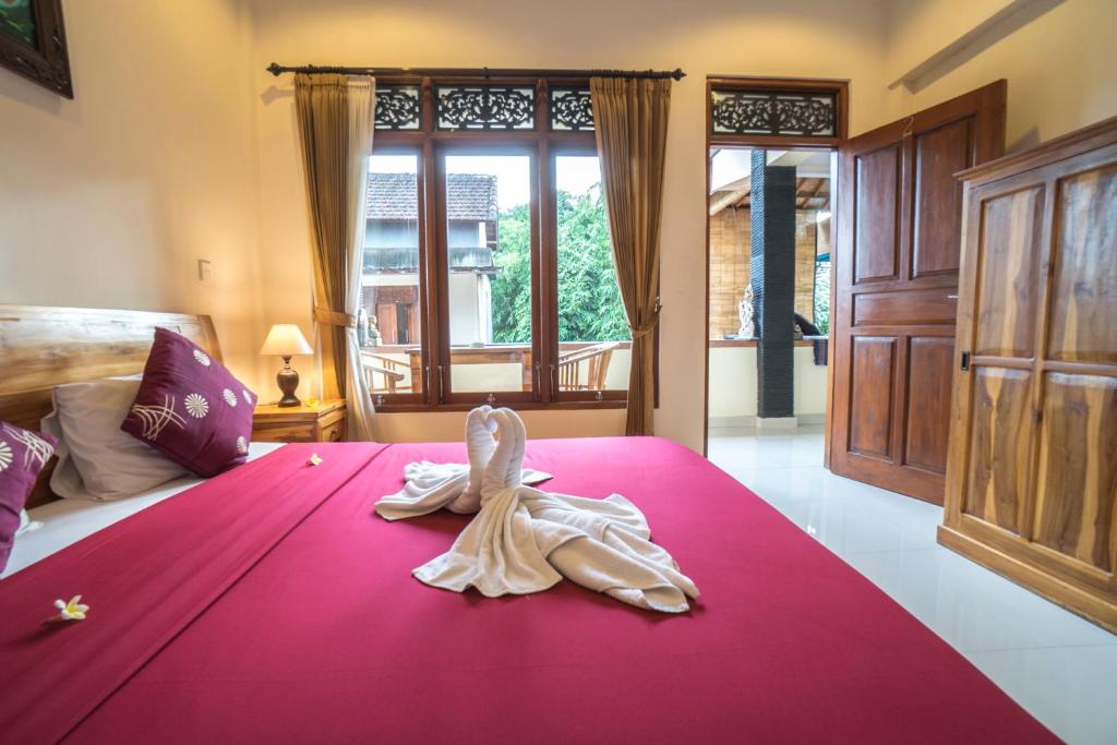 Postel nebo postele na pokoji v ubytování Baba Homestay