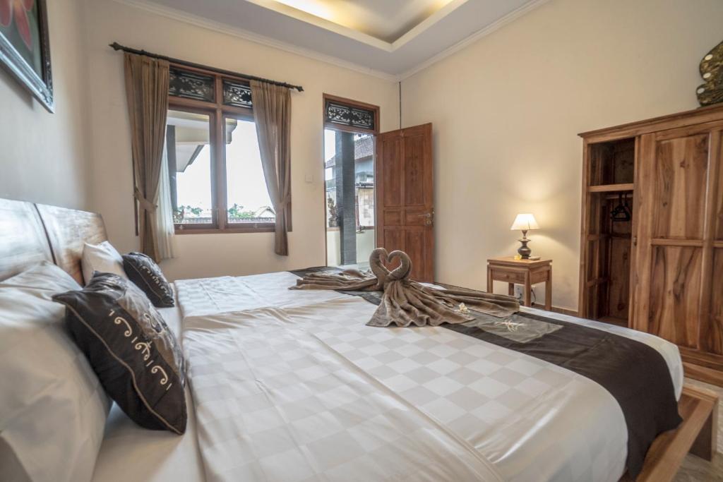 Postel nebo postele na pokoji v ubytování Baba Homestay
