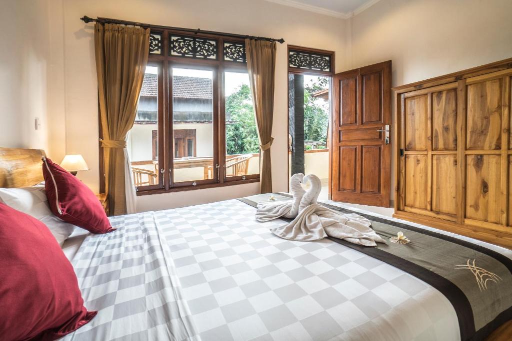 Postel nebo postele na pokoji v ubytování Baba Homestay