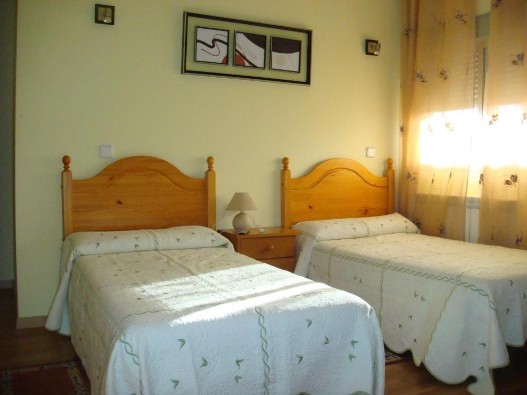 Postel nebo postele na pokoji v ubytování Hostal Madrid Paris