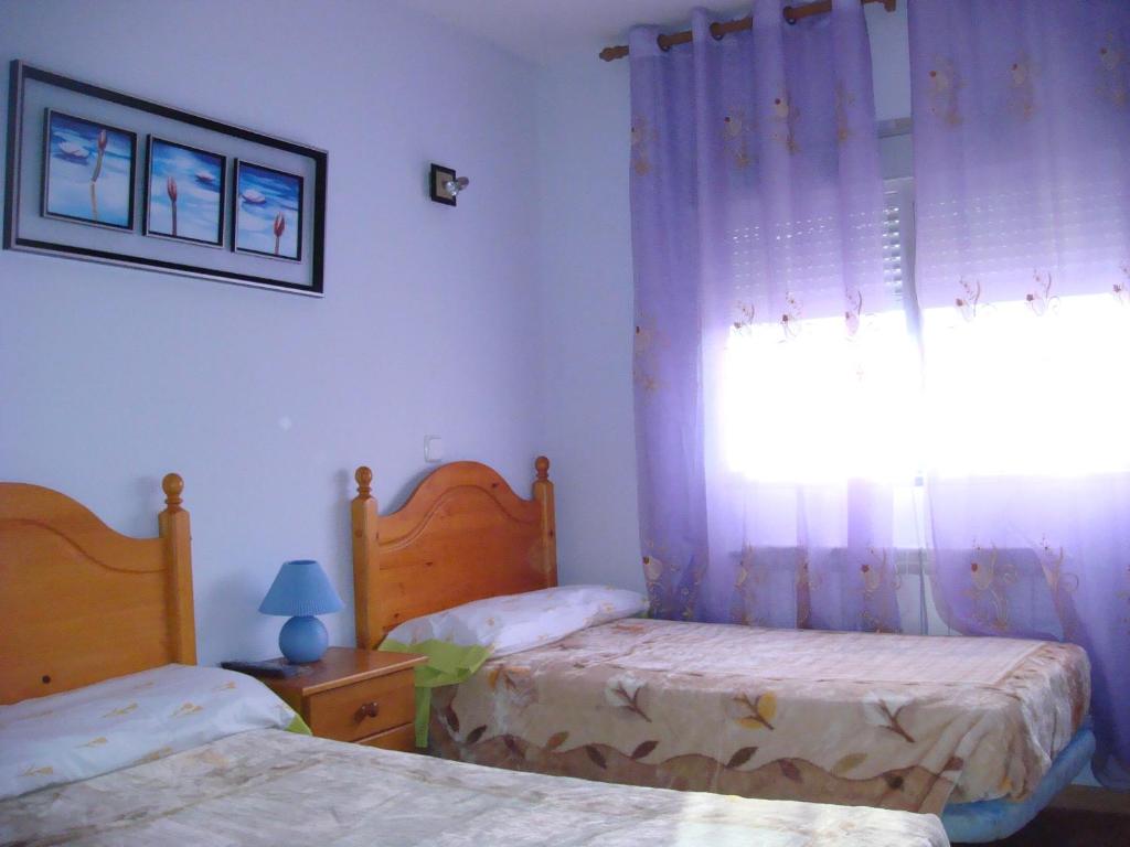 Postel nebo postele na pokoji v ubytování Hostal Madrid Paris
